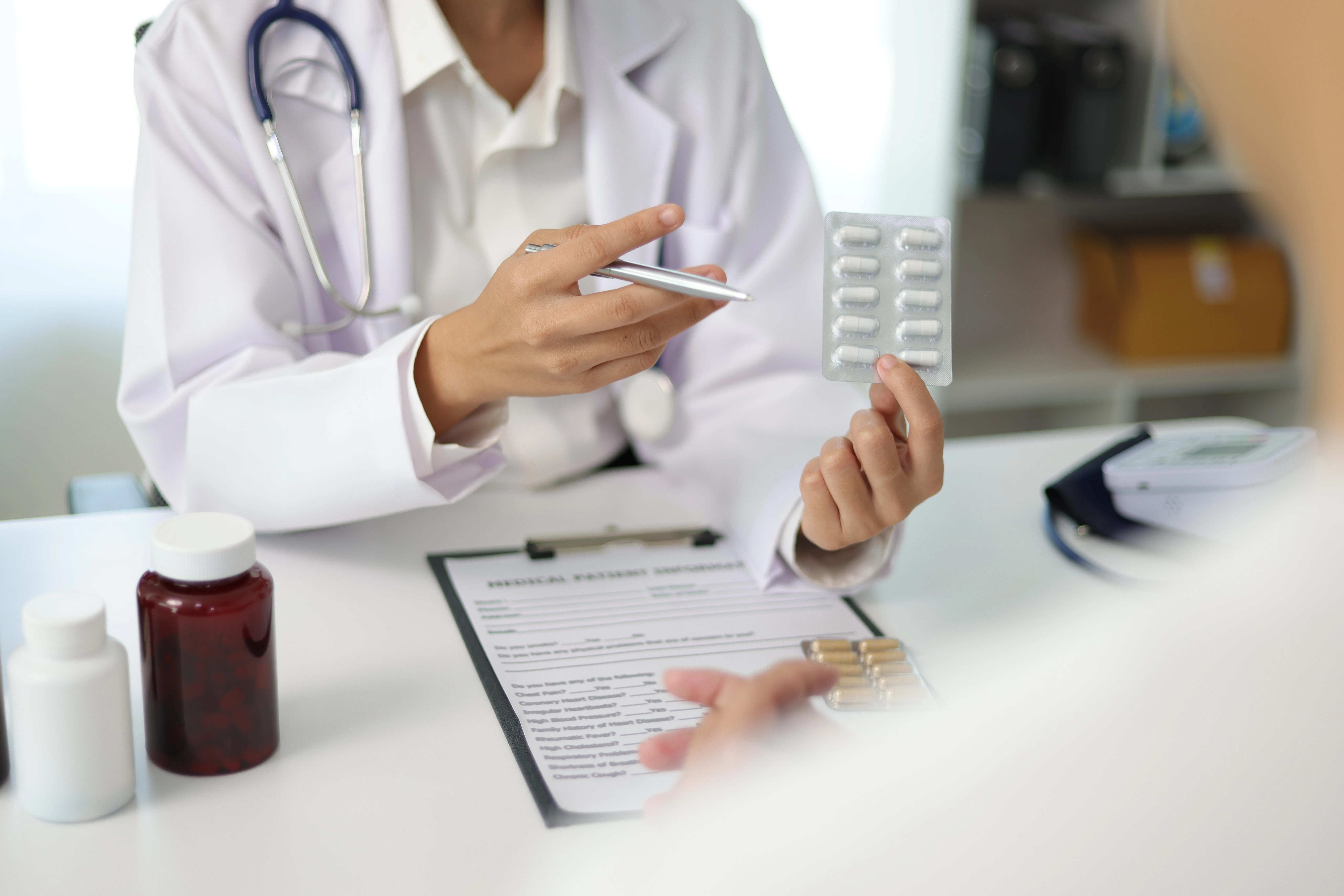 Haemorrhoid surgeon prescribing patient with medication